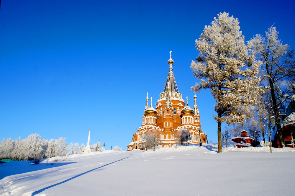 a church in the middle of a snowy field