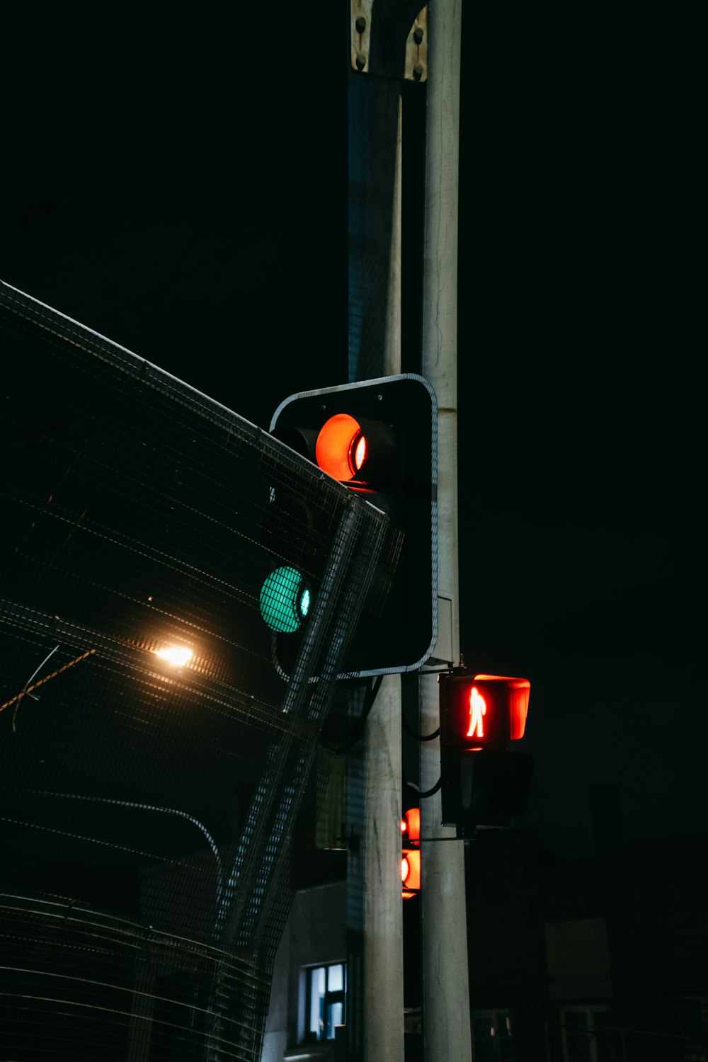 a couple of traffic lights on a pole