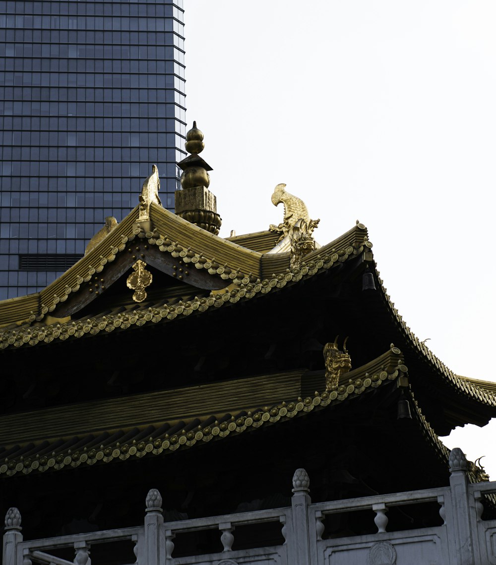 the roof of a building with a tall building in the background