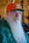 a man with a long white beard wearing an orange hat