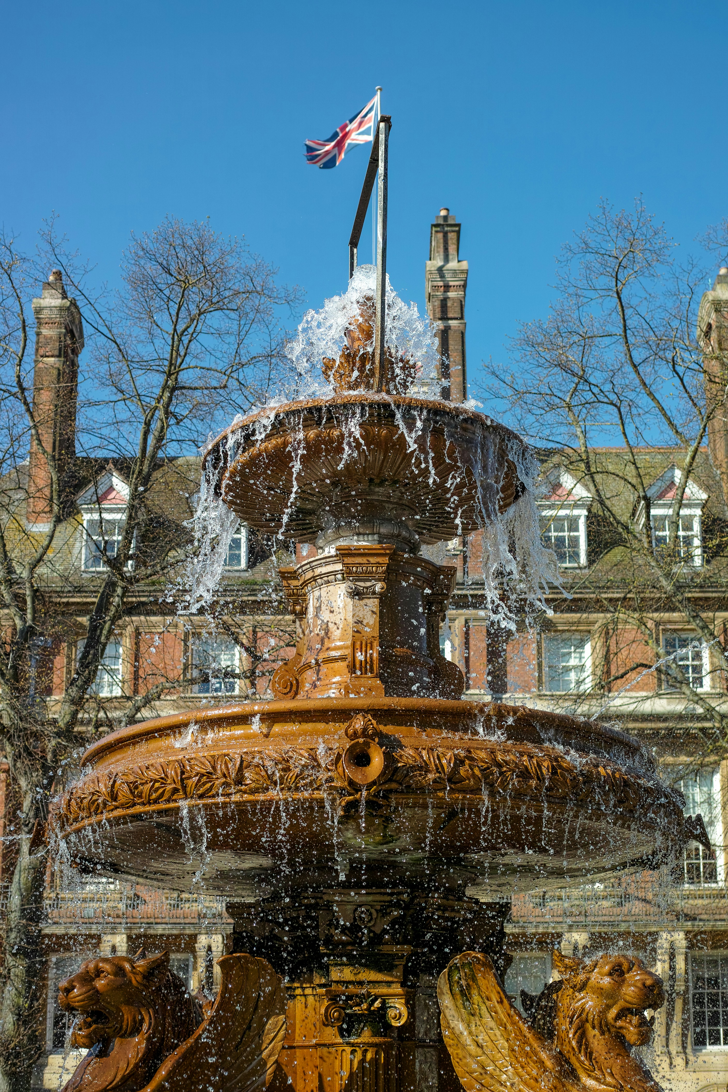 a water fountain with a flag on top of it