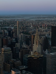 Aerial view of Gurugram’s skyline with luxury residential towers at dusk.
