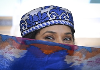 a close up of a person wearing a hat