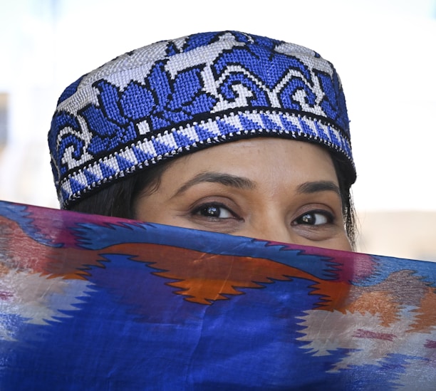 a close up of a person wearing a hat