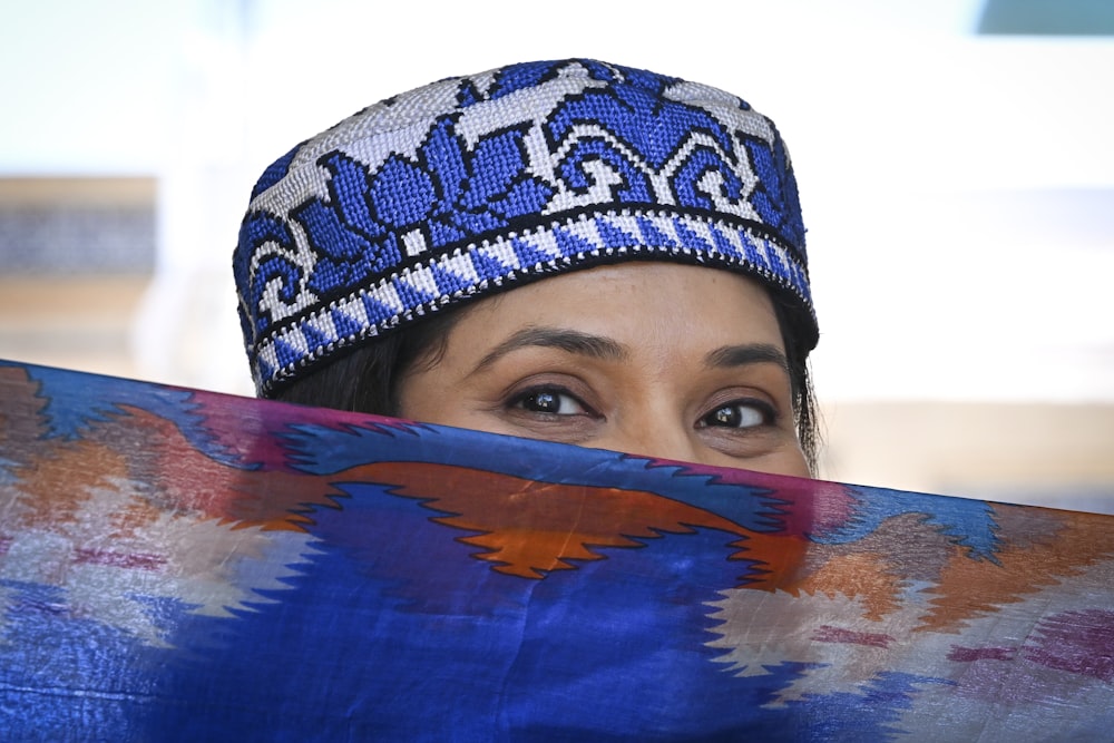 a close up of a person wearing a hat