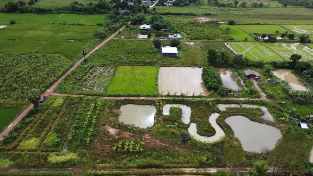 an aerial view of a farm with lots of water