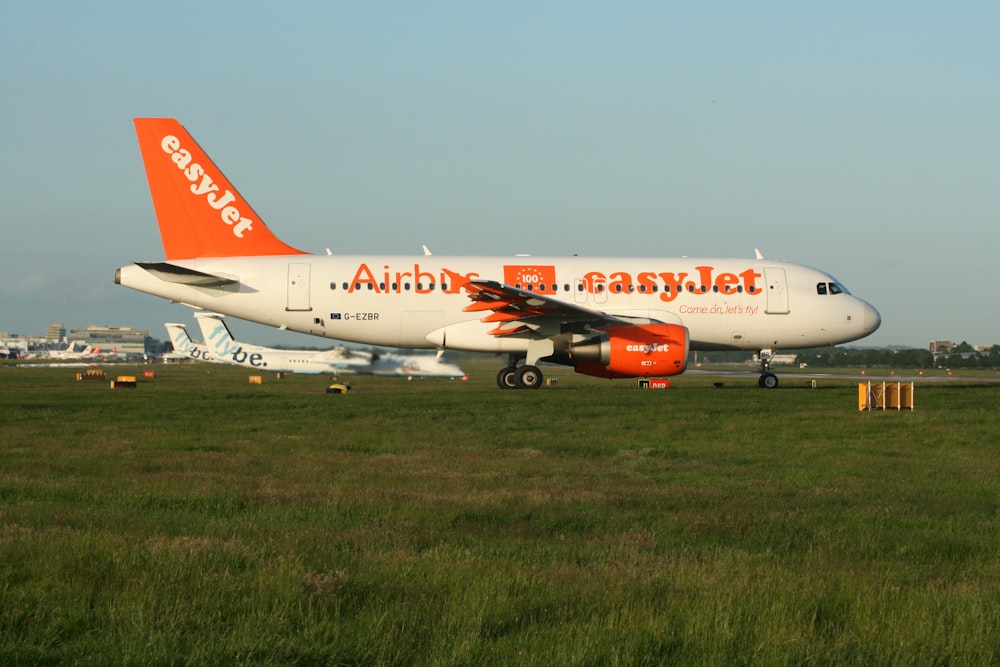 a large jetliner sitting on top of an airport runway