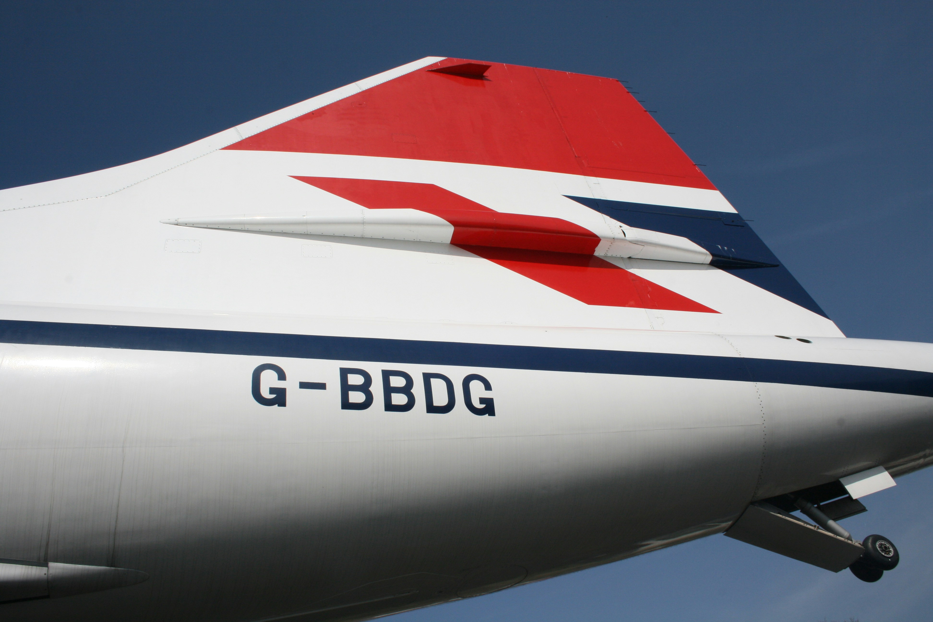 a close up of the tail end of an airplane, Concorde G-BBDG sits at Booklands Museum