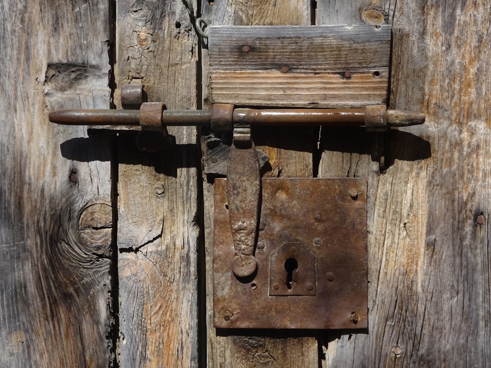 a close up of a wooden door with a lock
