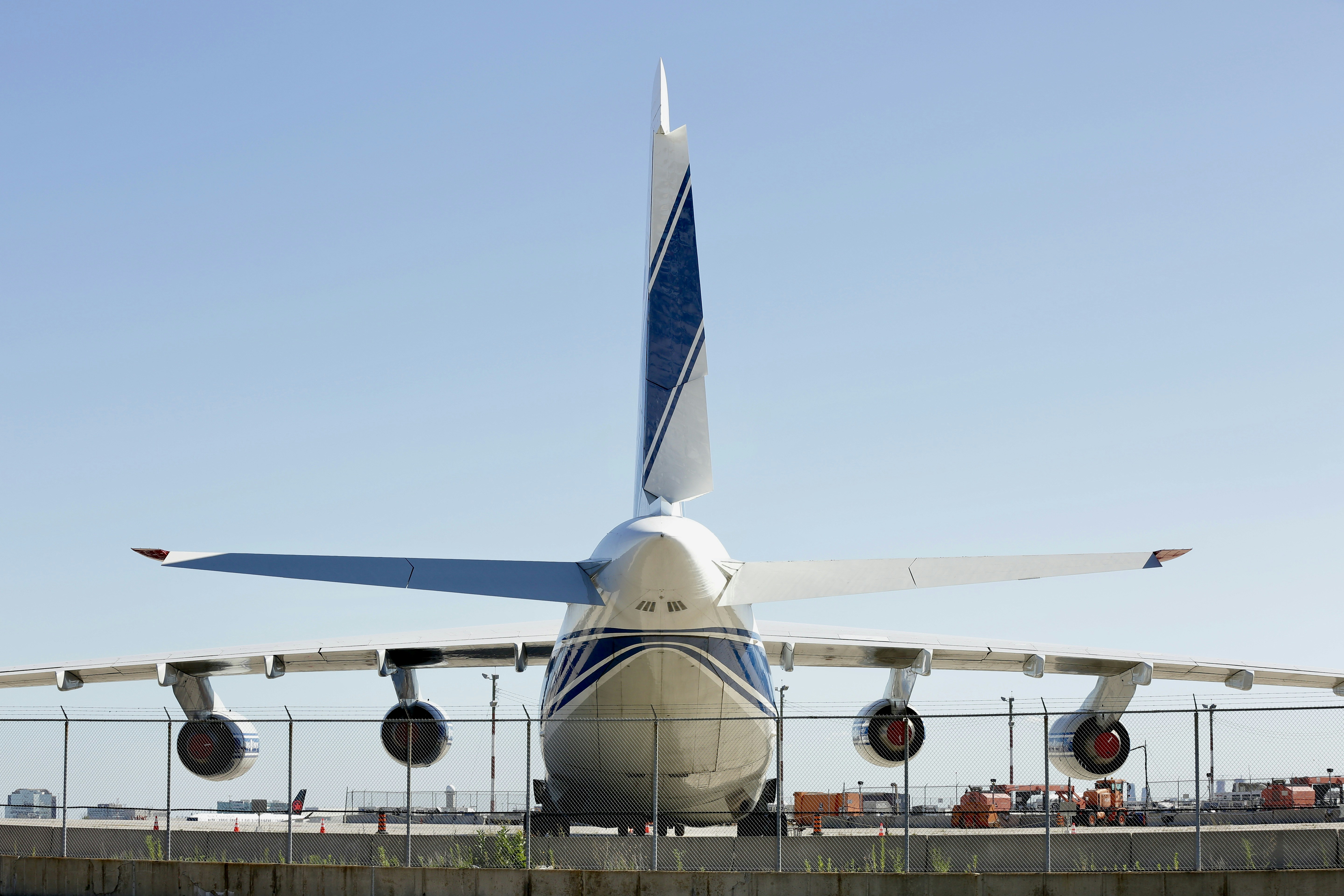 a large jetliner sitting on top of an airport tarmac, 