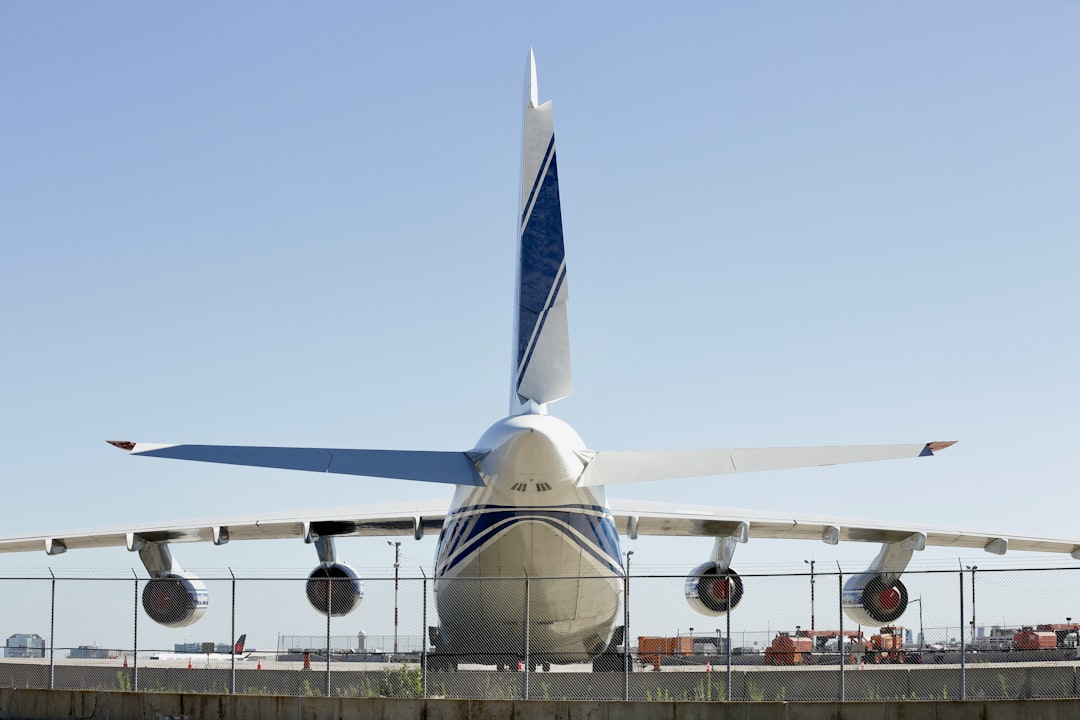 a large jetliner sitting on top of an airport tarmac,