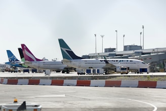 a couple of airplanes that are on a runway