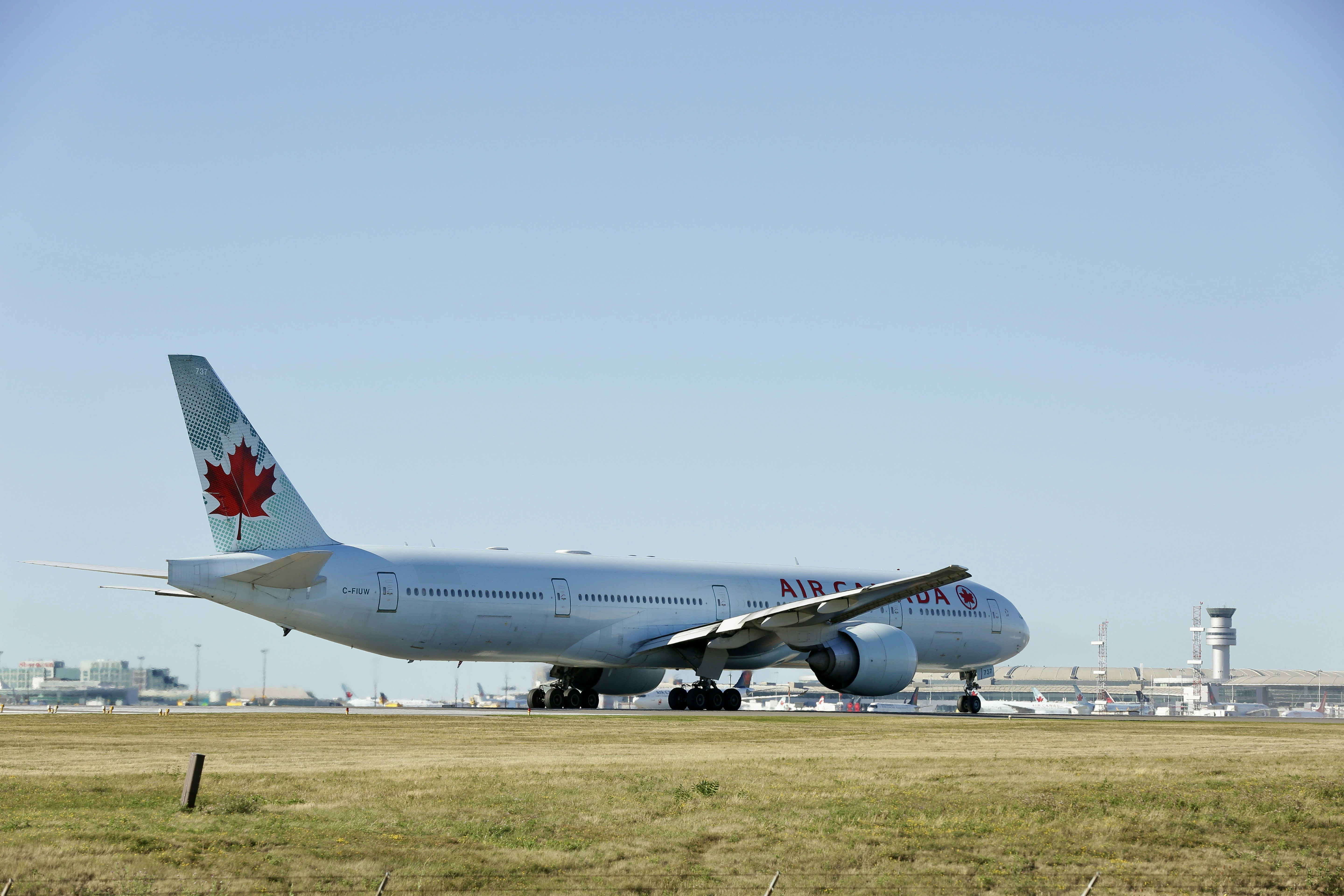 a large jetliner sitting on top of an airport runway
