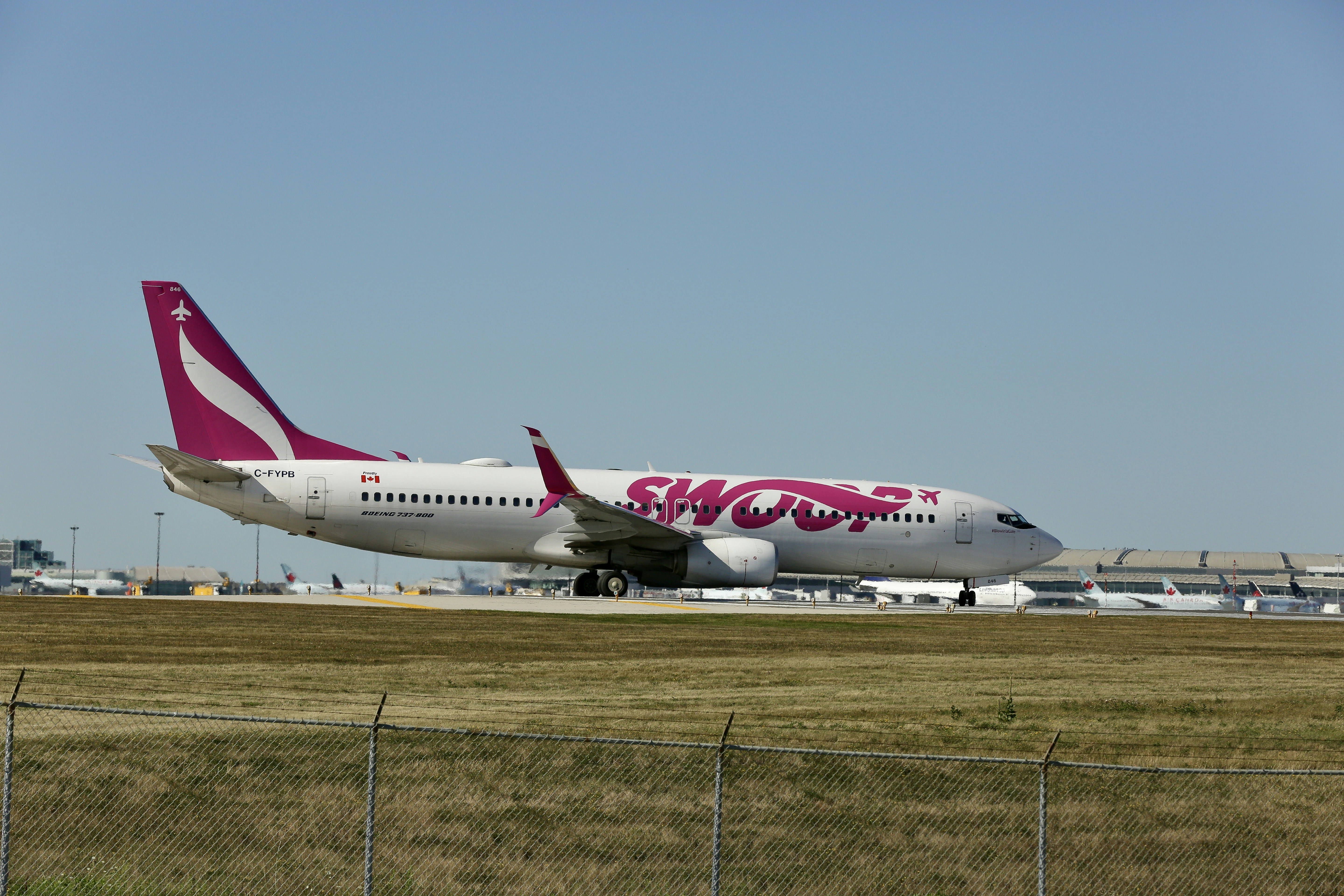 a large jetliner sitting on top of an airport runway
