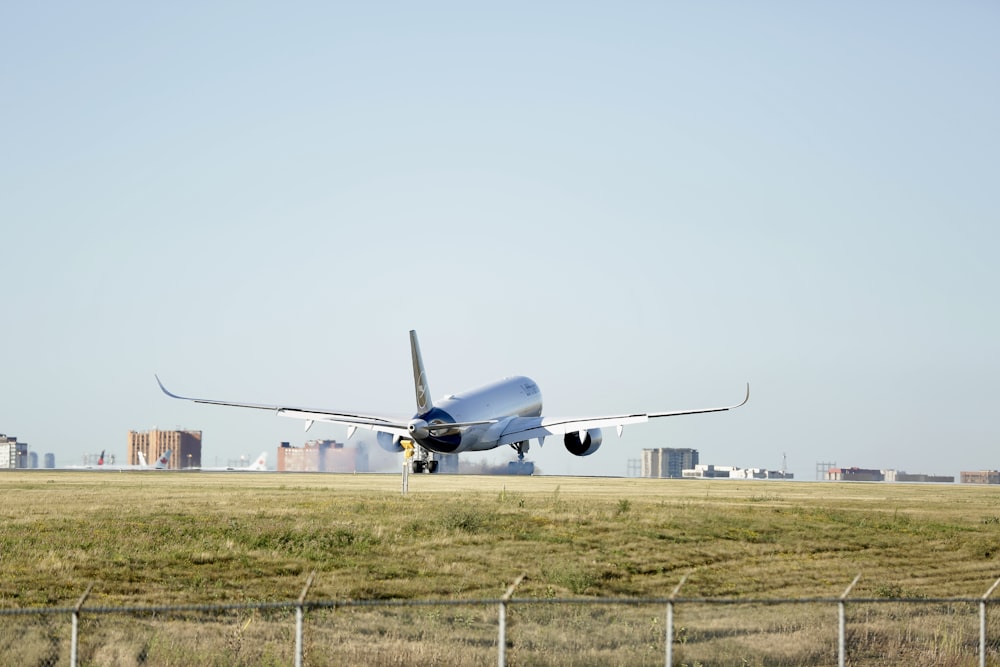 a large jetliner taking off from an airport runway