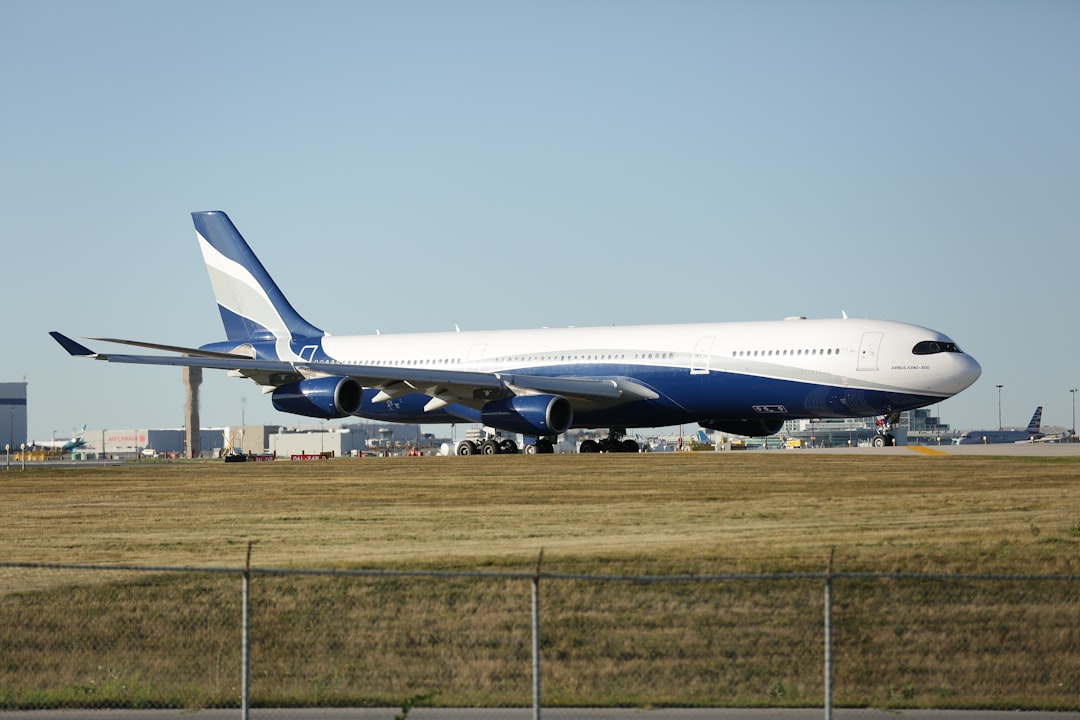 a large jetliner sitting on top of an airport runway,