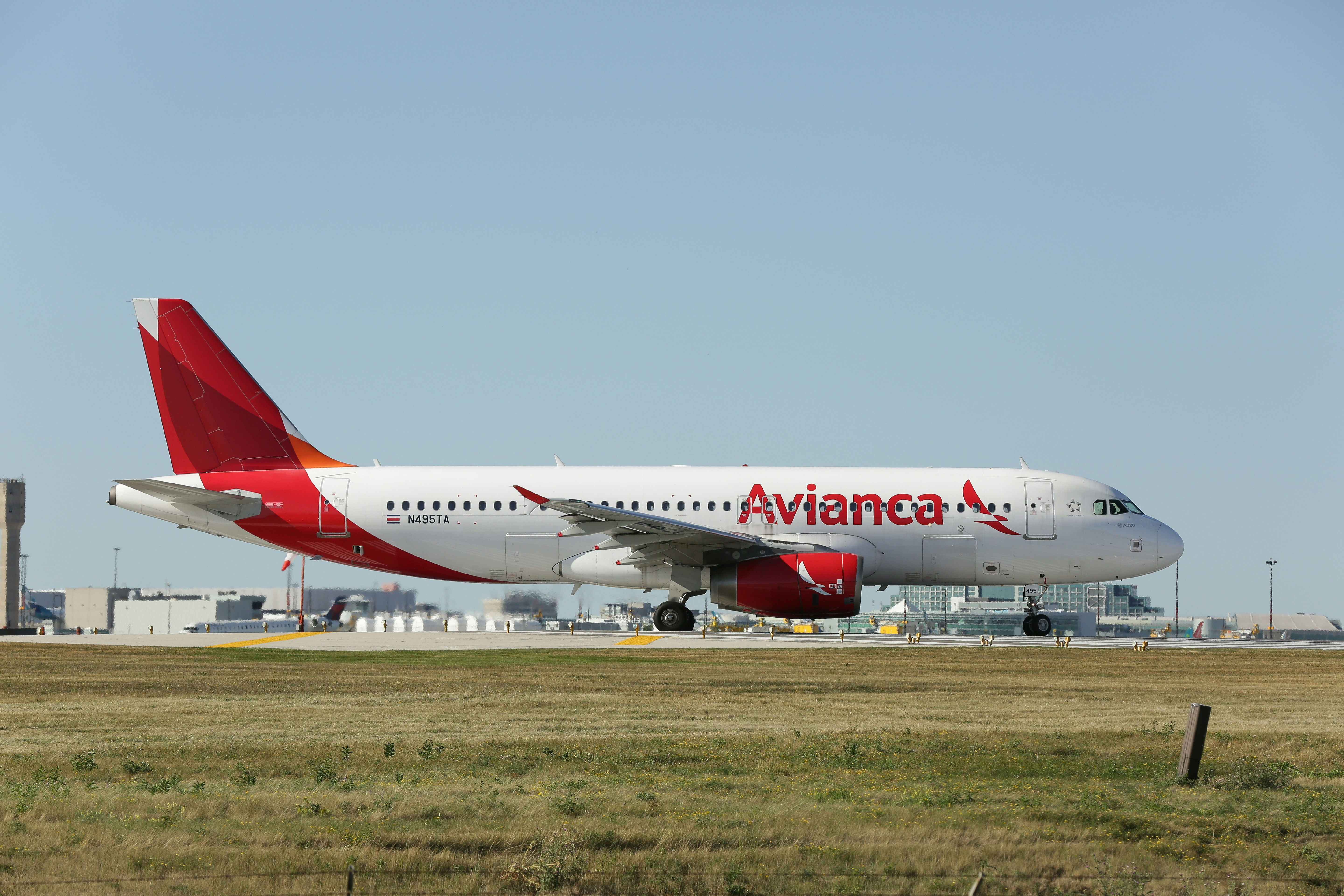 a large passenger jet sitting on top of an airport runway, 