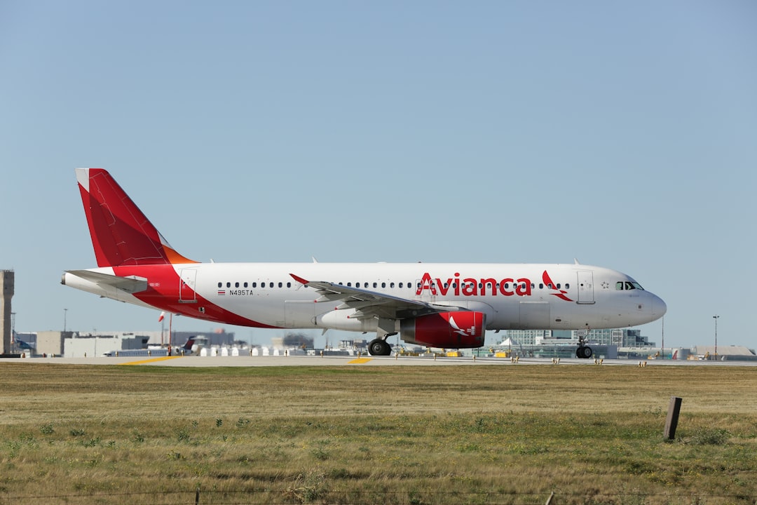 a large passenger jet sitting on top of an airport runway,