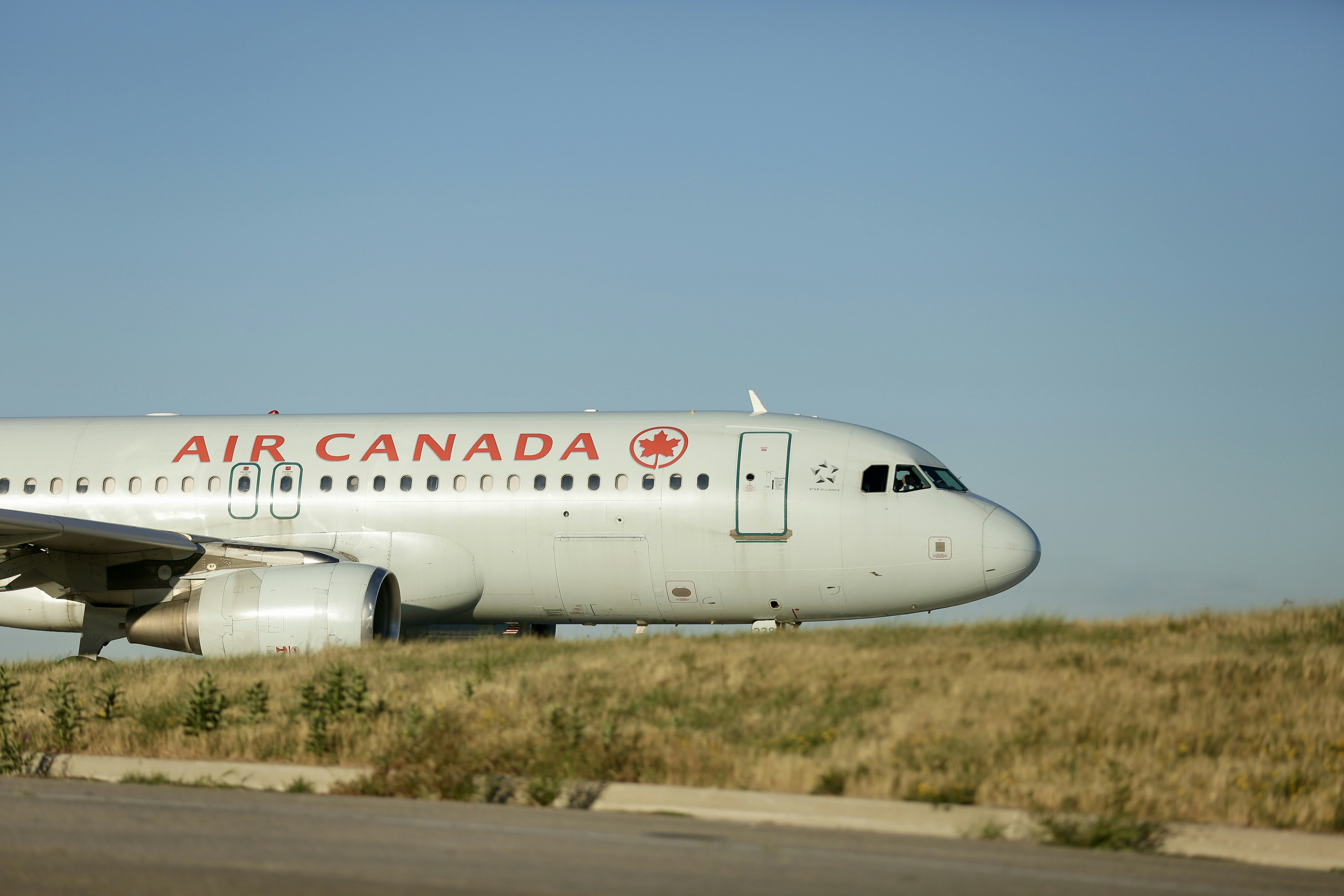 a large air canada airplane on a run way