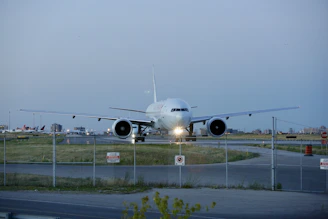 Nighttime view of a cargo plane taking off under clear skies