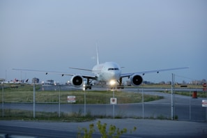 A CW Air Cargo freighter plane preparing for takeoff on a clear morning runway.