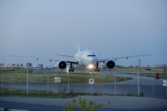 A CW Air Cargo freighter plane preparing for takeoff on a clear morning runway.