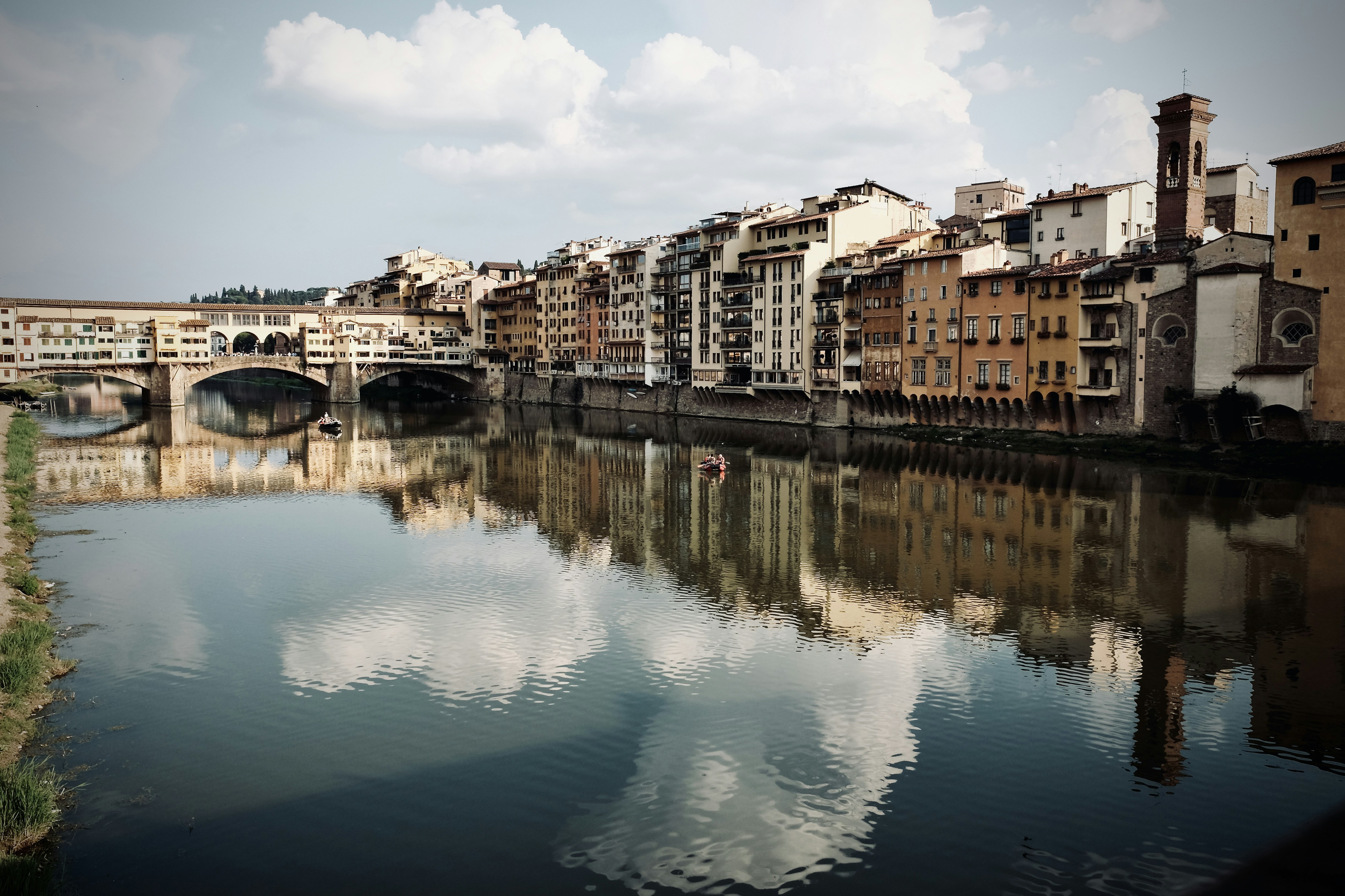 a river running through a city next to tall buildings
