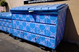 A close-up of a colorful dumpster showcasing its features.