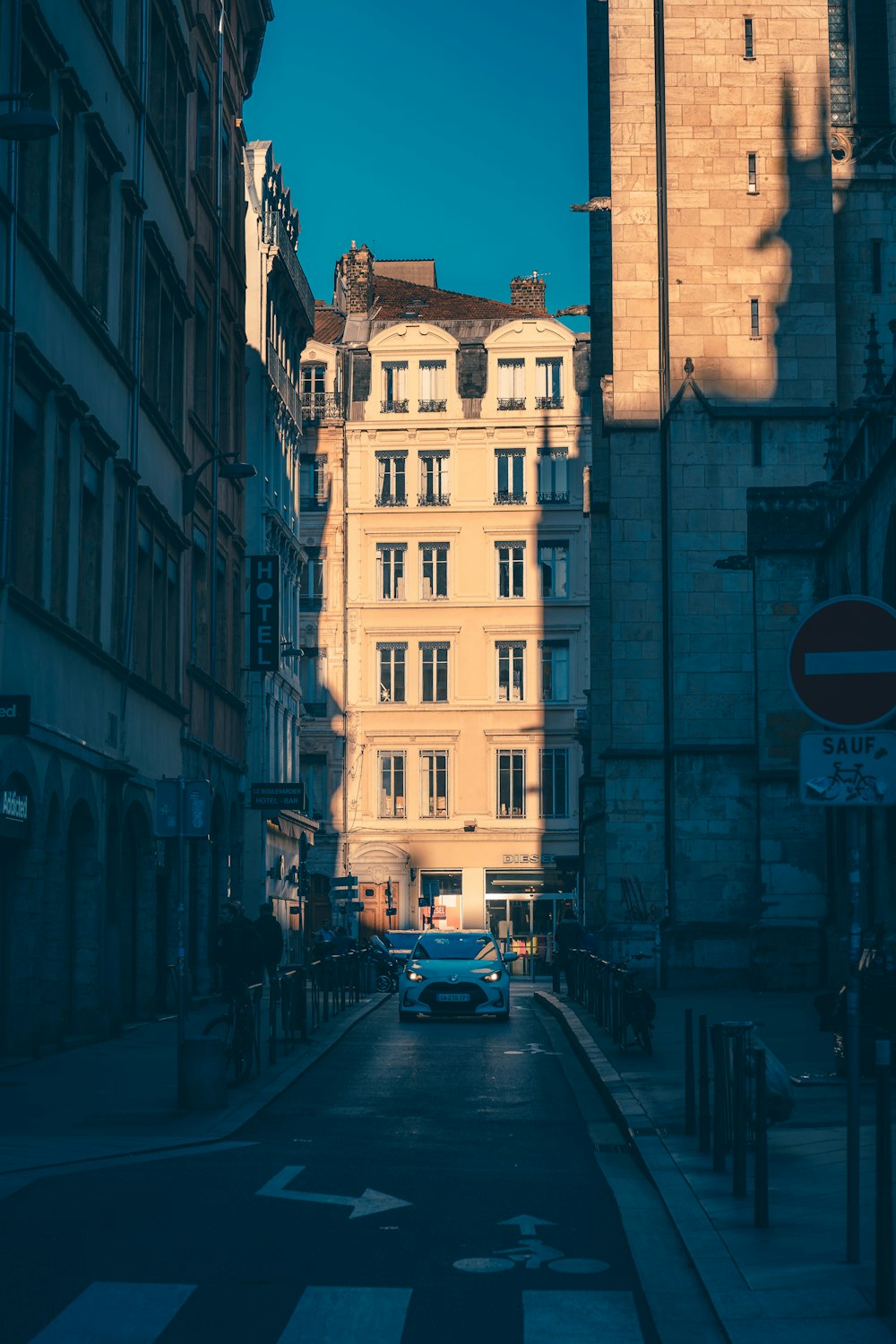 a street lined with tall buildings next to each other