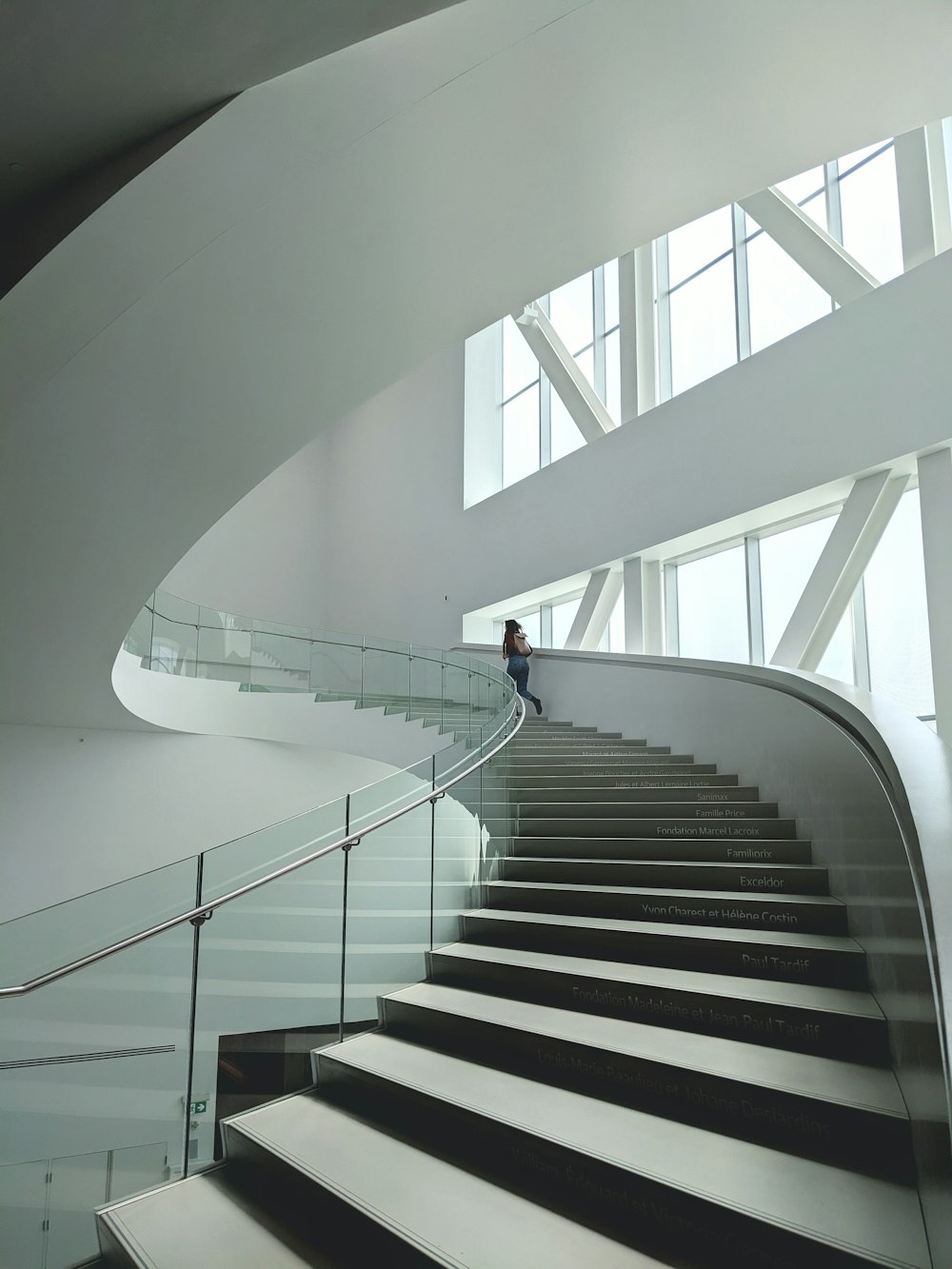 a man is walking down a set of stairs