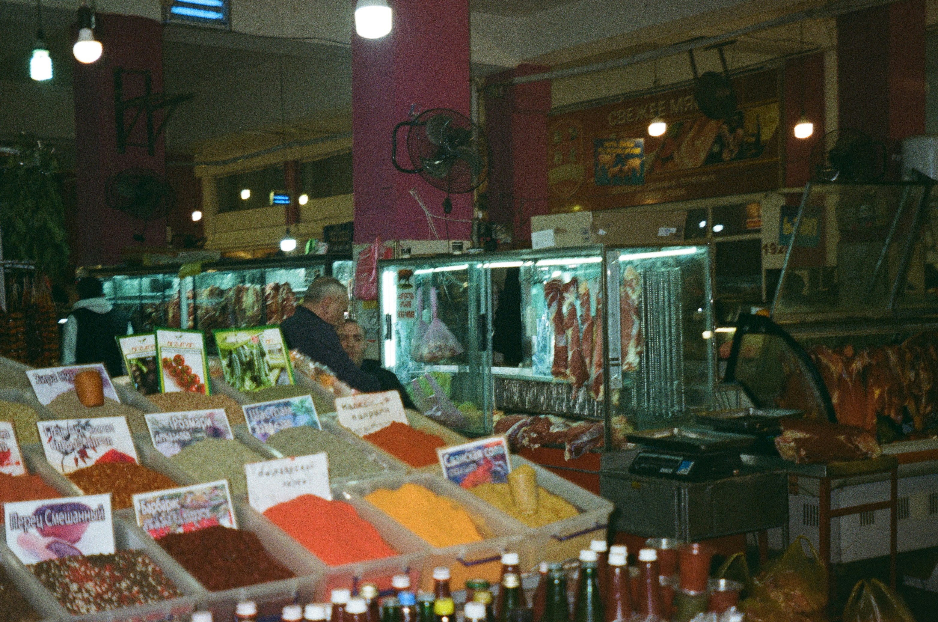 Bins of colourful spices in a market store