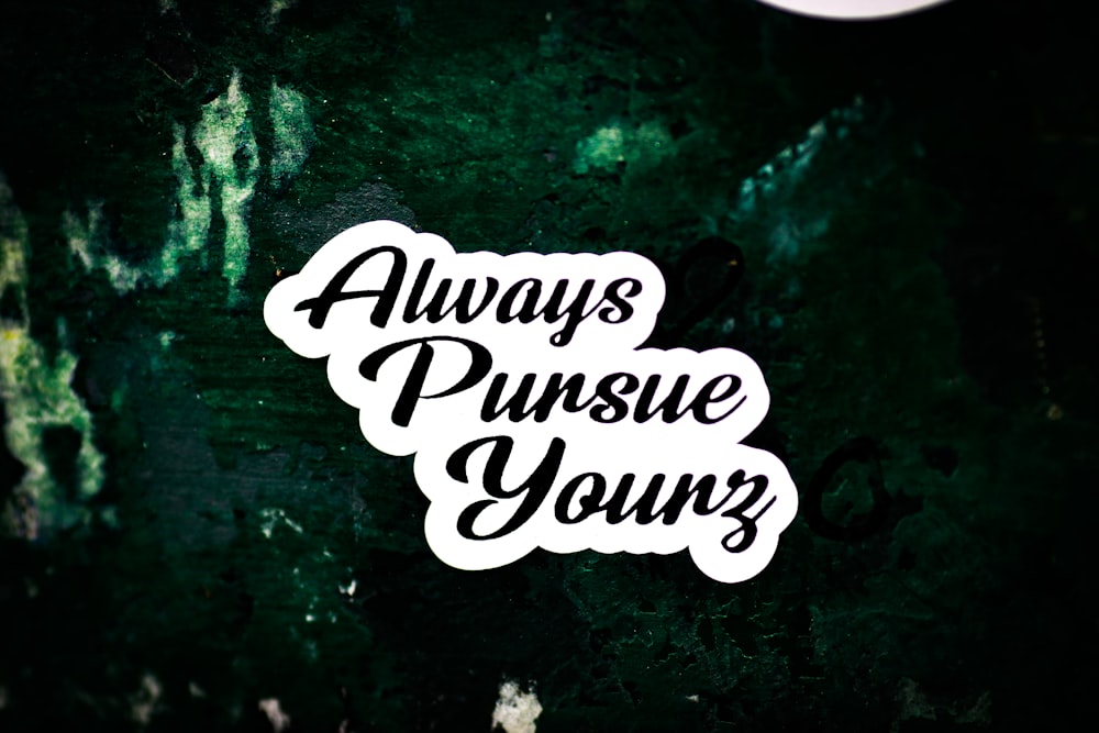 a sticker that says, always pursue yours