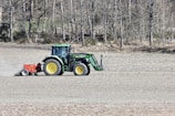 Tractor working the field during early morning light