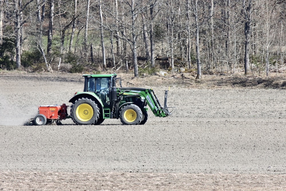 a tractor plowing a field with a plow