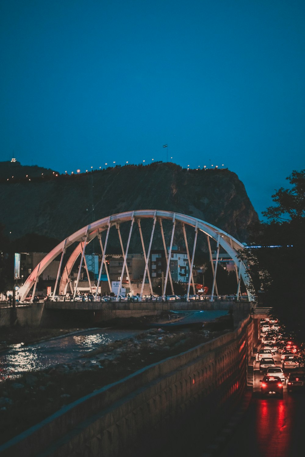 a bridge over a body of water at night