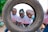 a group of men standing next to each other in front of a tire