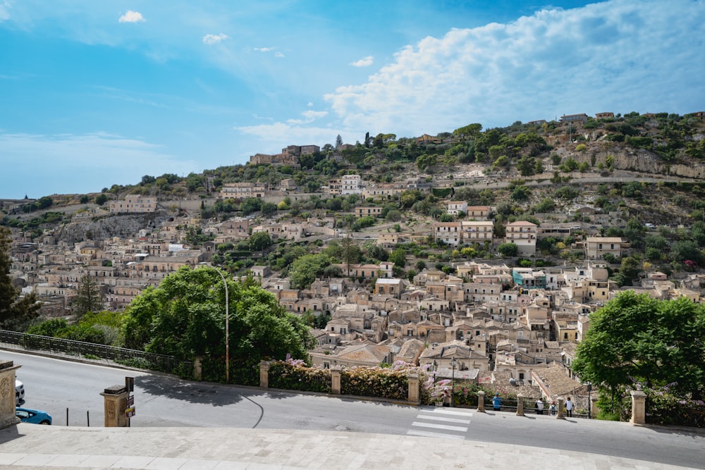 a view of a city with a hill in the background