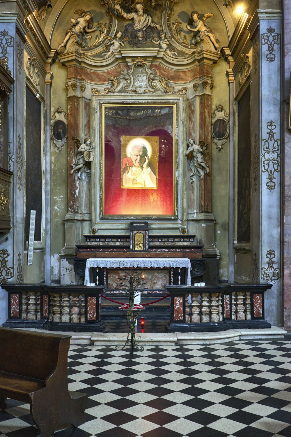 a church with a large painting on the wall