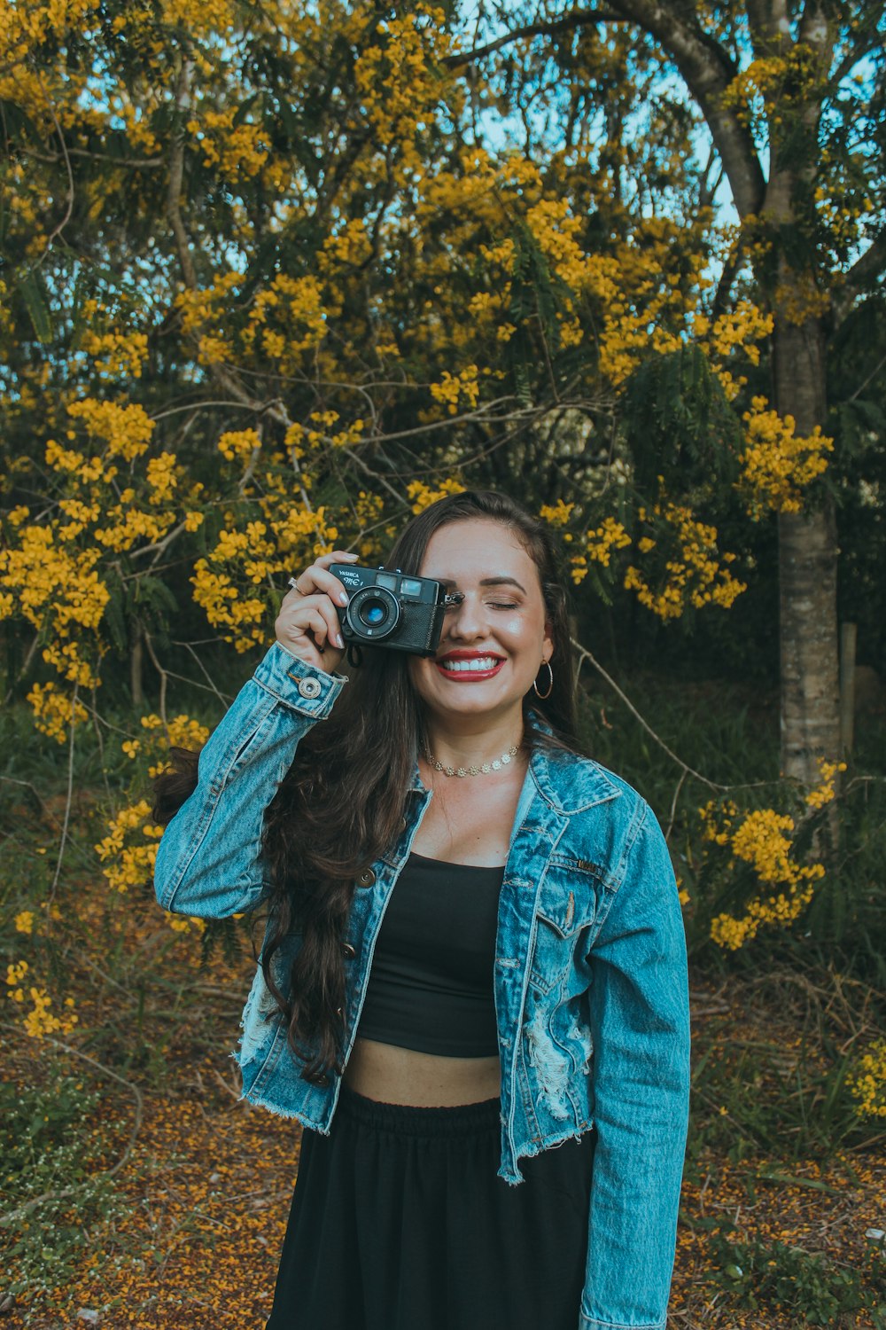 a woman taking a picture with a camera