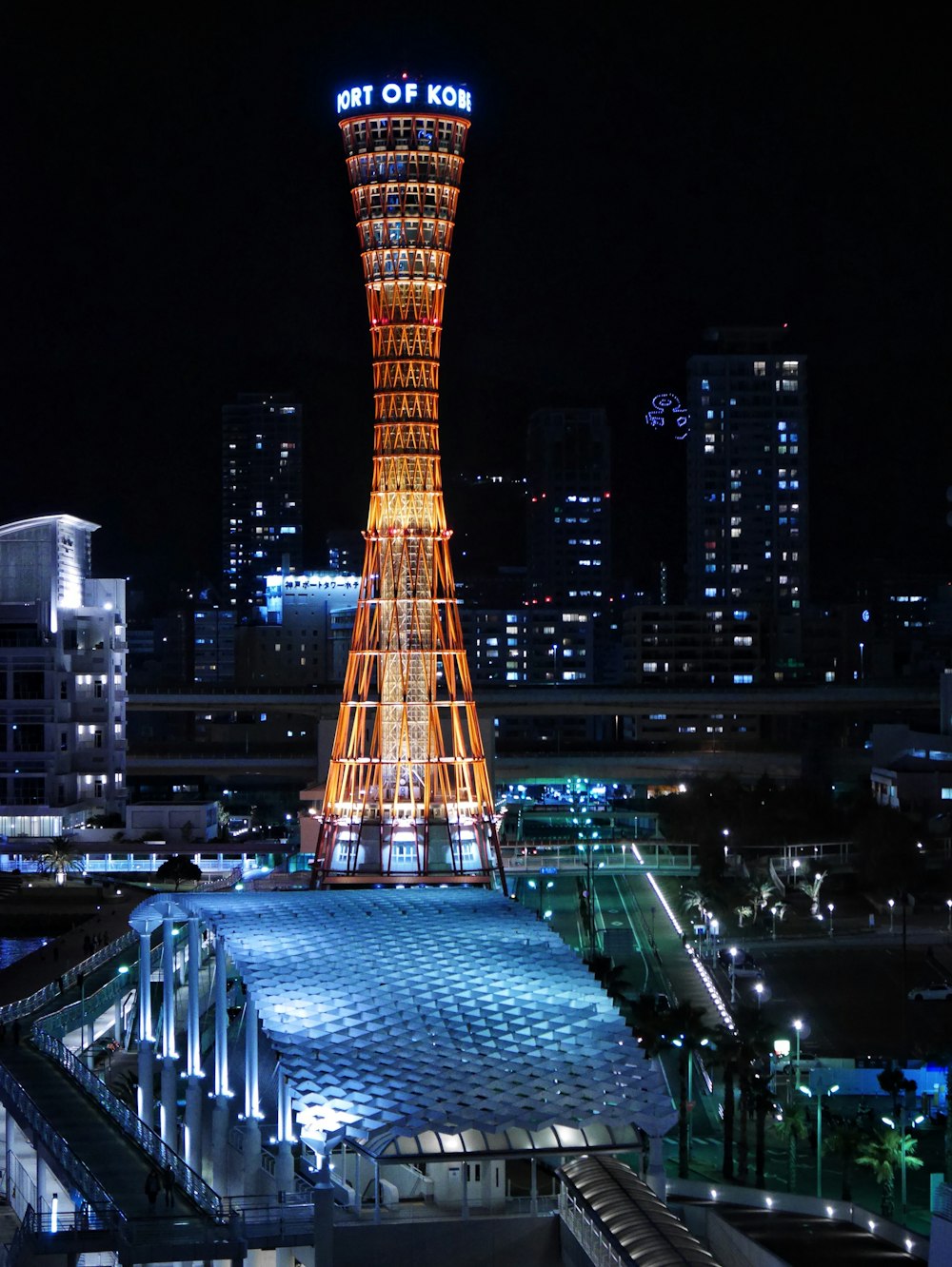 a very tall tower lit up at night