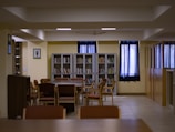a room filled with lots of chairs and a table
