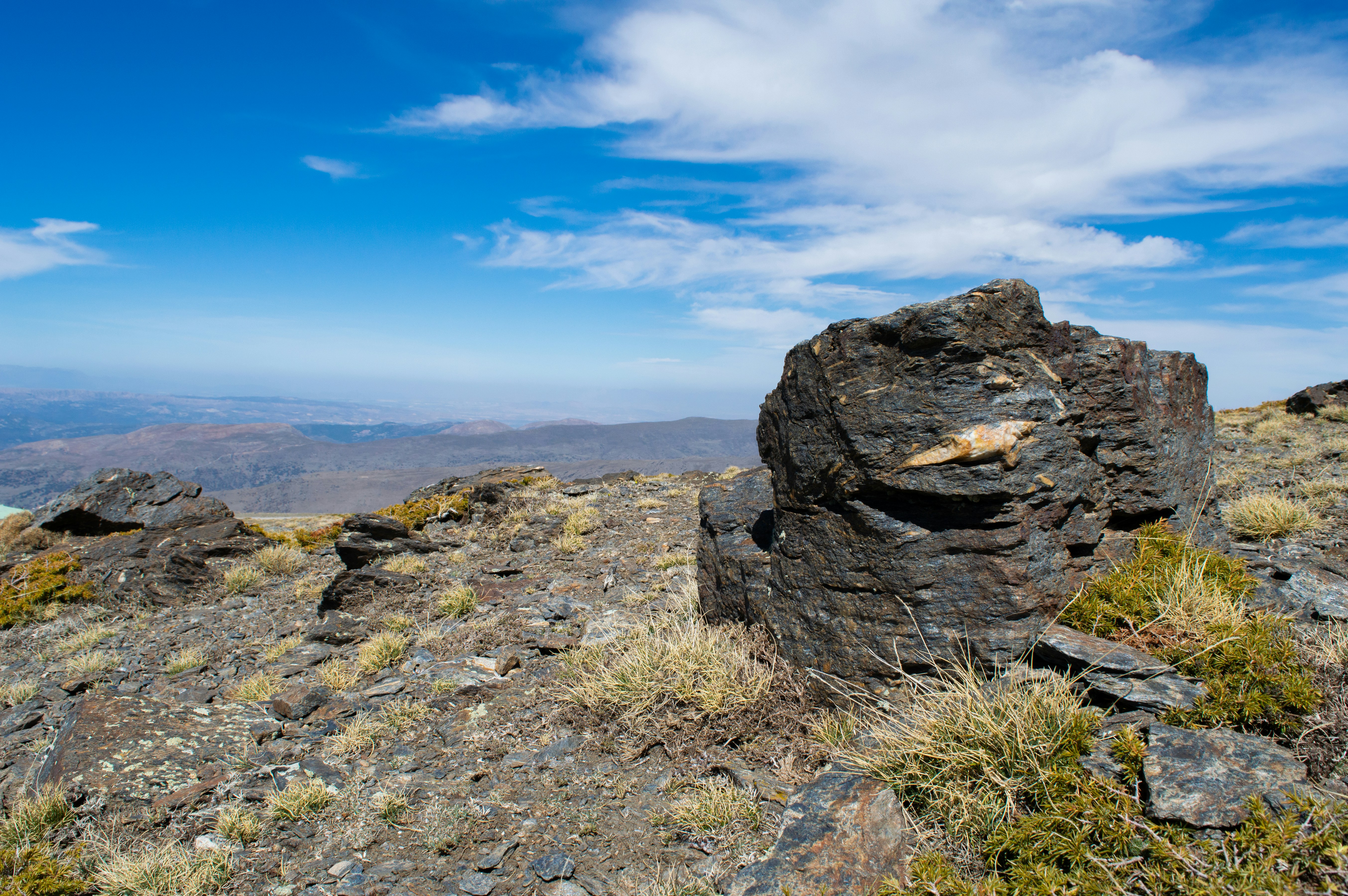 a rock outcropping on top of a mountain