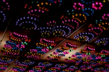 A cluster of colorful vector-inspired ceiling lights creating a vibrant atmosphere.