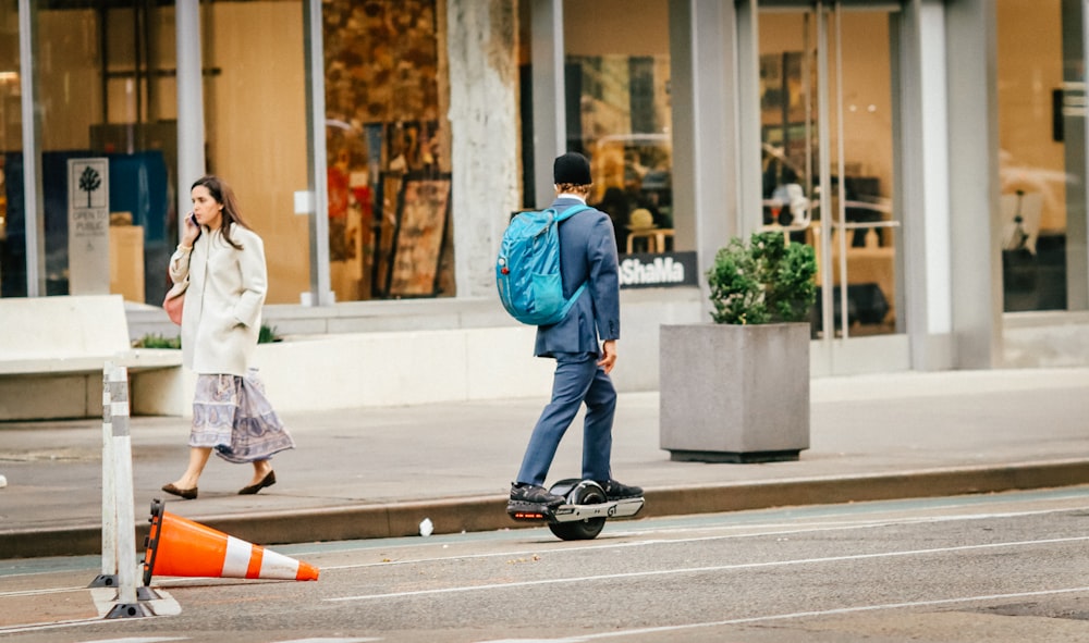 a man and a woman walking down a street