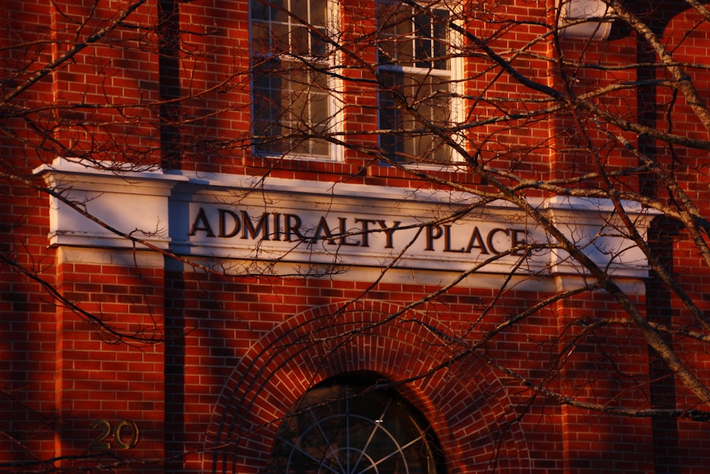 a red brick building with a sign that reads admirality place