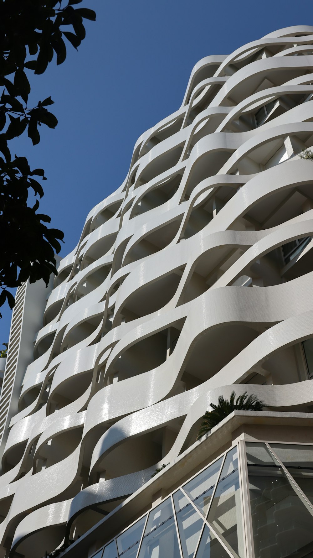 a tall white building with lots of windows