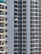 Close-up of a finished apartment balcony overlooking a bustling urban neighborhood.