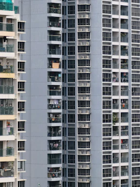 Balcony view overlooking Uttam Nagar neighborhood from a high-rise luxury flat.