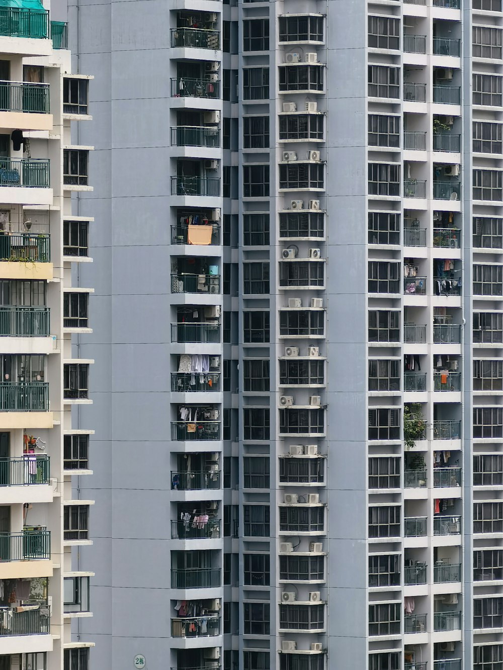 a very tall building with lots of balconies