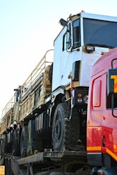 a large truck on a flatbed tow truck